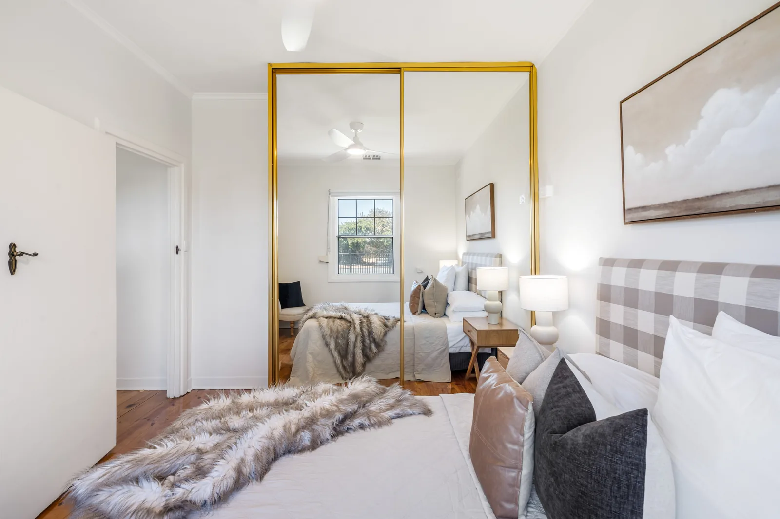 Master bedroom with mirrored wardrobe