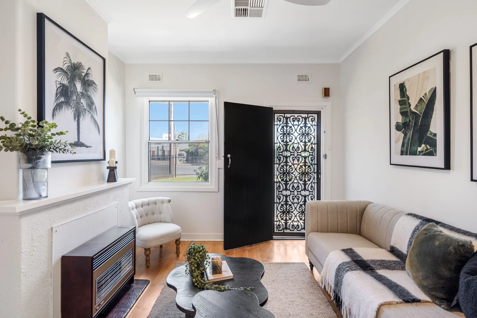 Entry living area with ornate screen door
